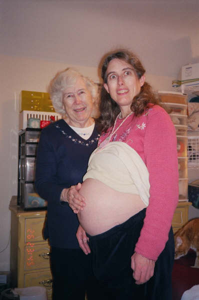 pregnancy photo - two generations looking at belly