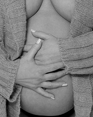 pregnancy photo - mums hands on pregnant belly